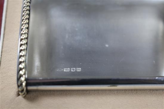 A George VI Cartier silver and yellow metal mounted cigarette case, in original fitted Cartier gilt tooled leather box.